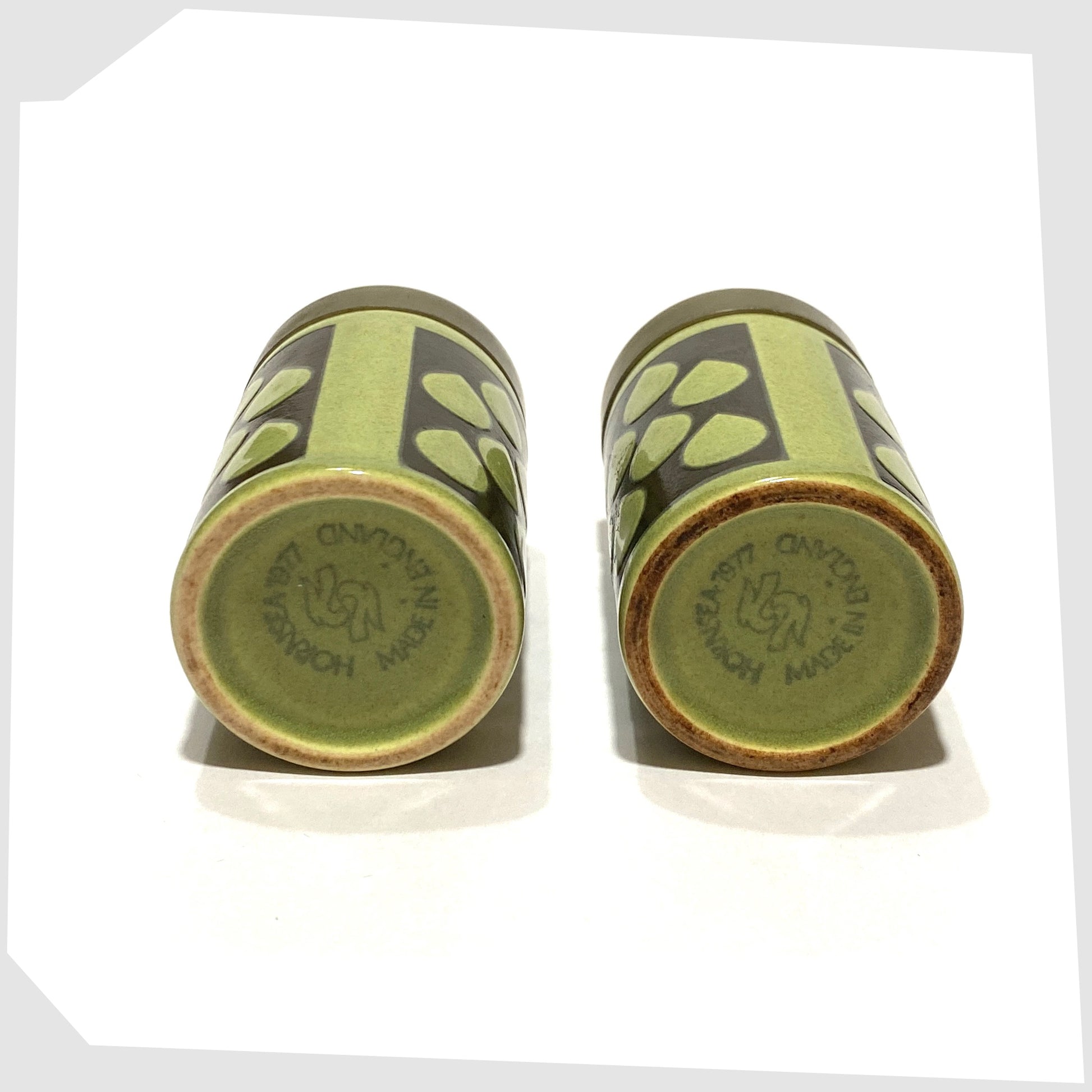 base of the 1977 Hornsea Pottery Raindrop Cruet set, in green glaze with black raindrop design, finished with gold lids