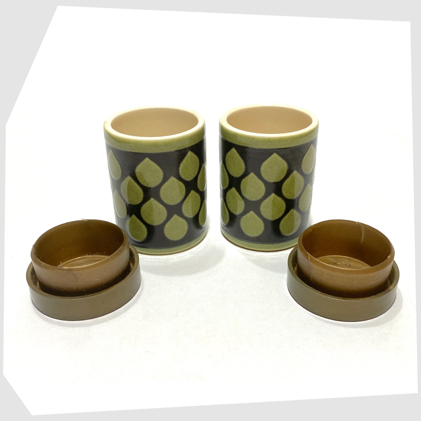 vintage Hornsea Pottery Raindrop Cruet set, in green glaze with black raindrop design, finished with gold lids, shown with lids removed