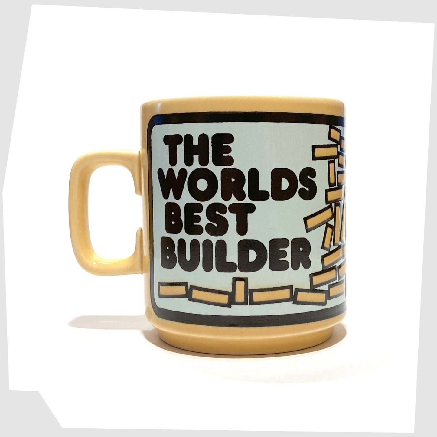 The Worlds Best Builder text on the Vintage Hornsea Pottery Mug featuring an illustration of a builder with his wonky brickwork