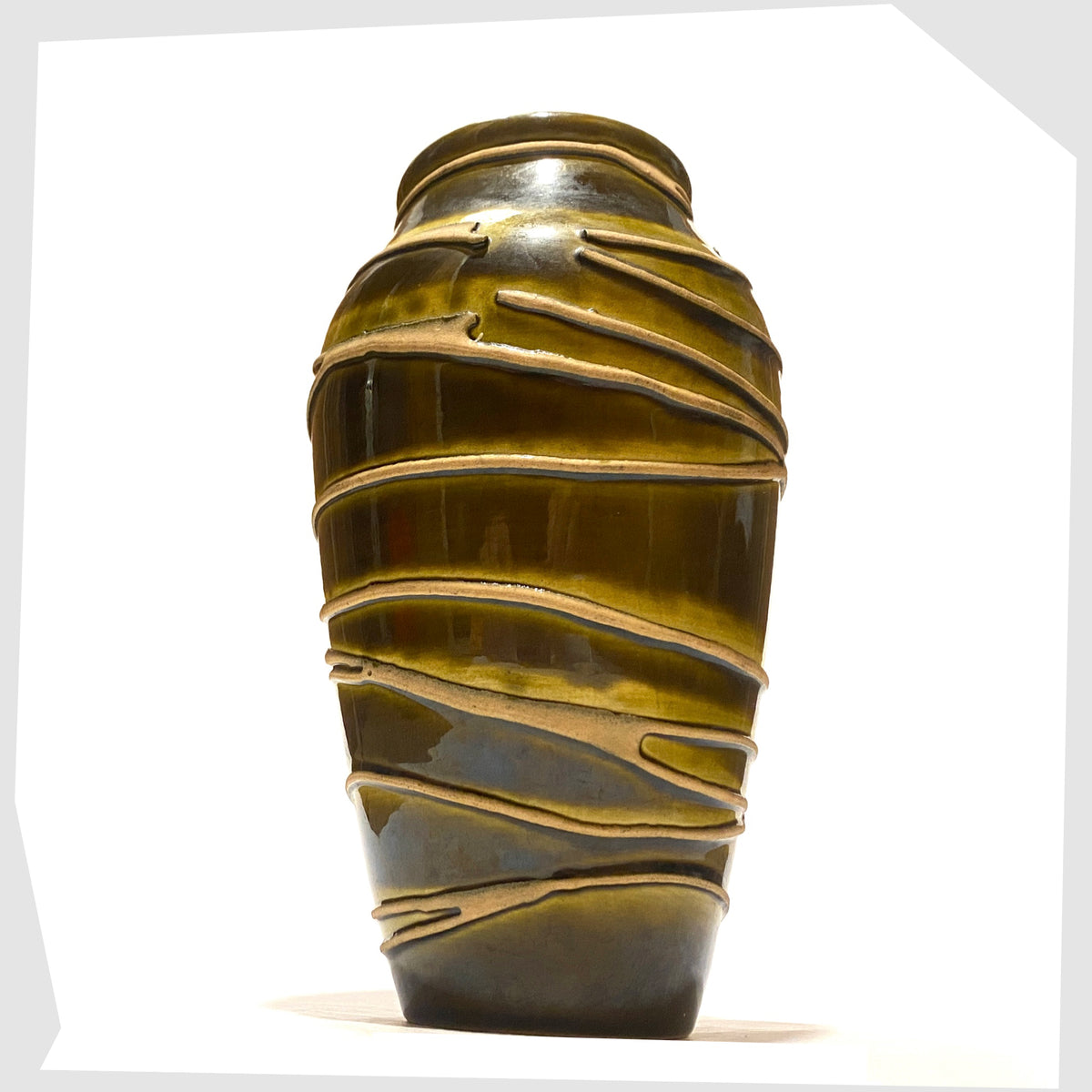 West German Pottery Ilkra Keramik 5/20 Vase finished in a rich green glaze with contrasting lines of matte clay, shown on a white background