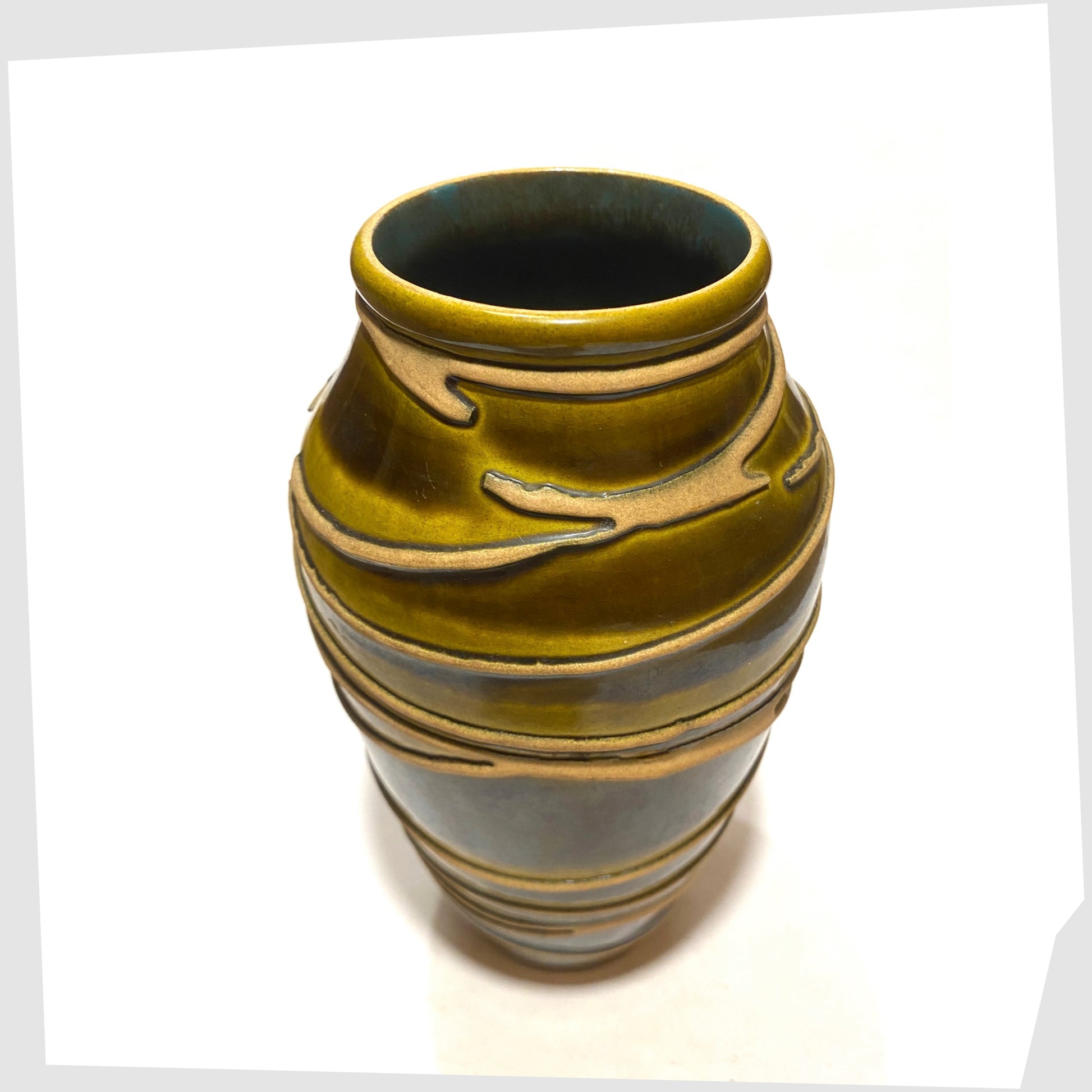 Top rim of the Ilkra Keramik 5/20 Vase finished in a rich green glaze with contrasting lines of matte clay, shown on a white background