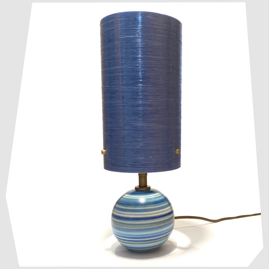 Hand-painted Jersey Pottery Spherical Table Lamp with a blue spun fibreglass lampshade, shown on a white background