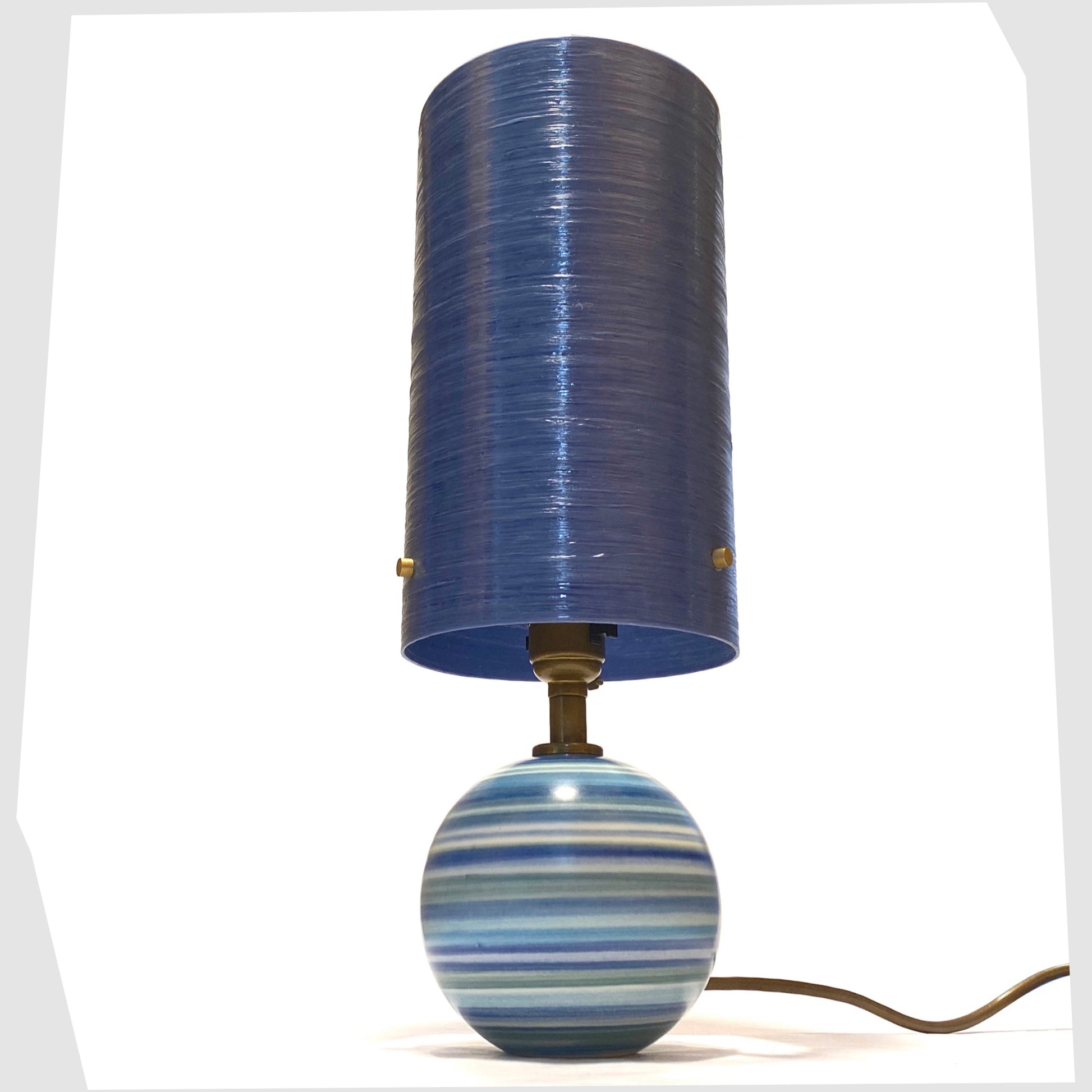 Hand-painted Jersey Pottery Table Lamp with a blue spun fibreglass lampshade, shown on a white background