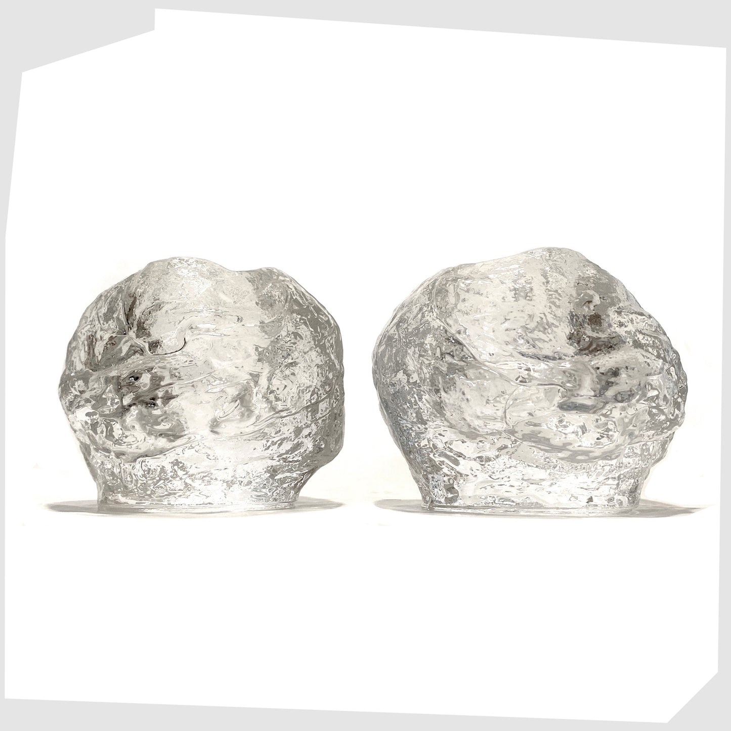 Pair of Kosta Boda Snowball Tealight holders, made in clear textured glass, designed in 1973