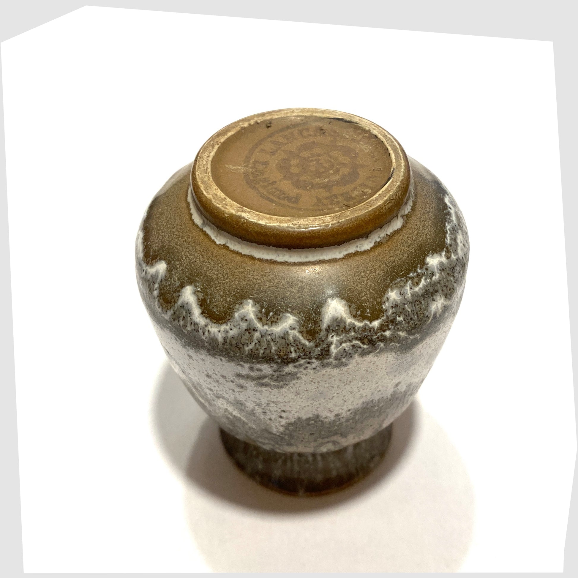 printed markings on the base of the Lancastrian Pottery Vase in a grey and white drip glaze