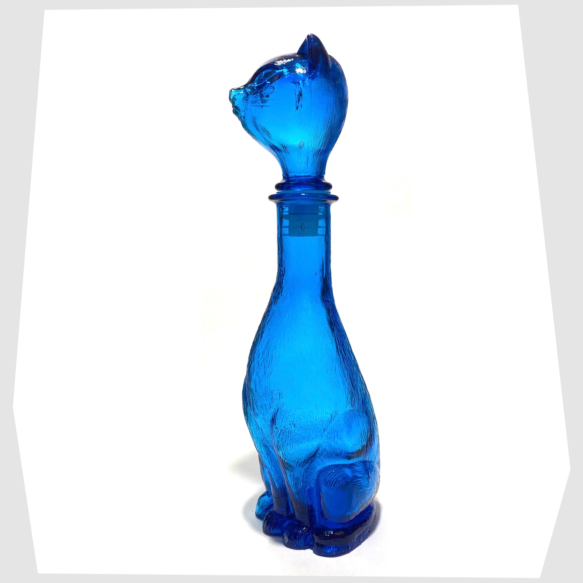 Side of the Empoli Art Glass Cat-Shaped Decorative Bottle in rich blue glass