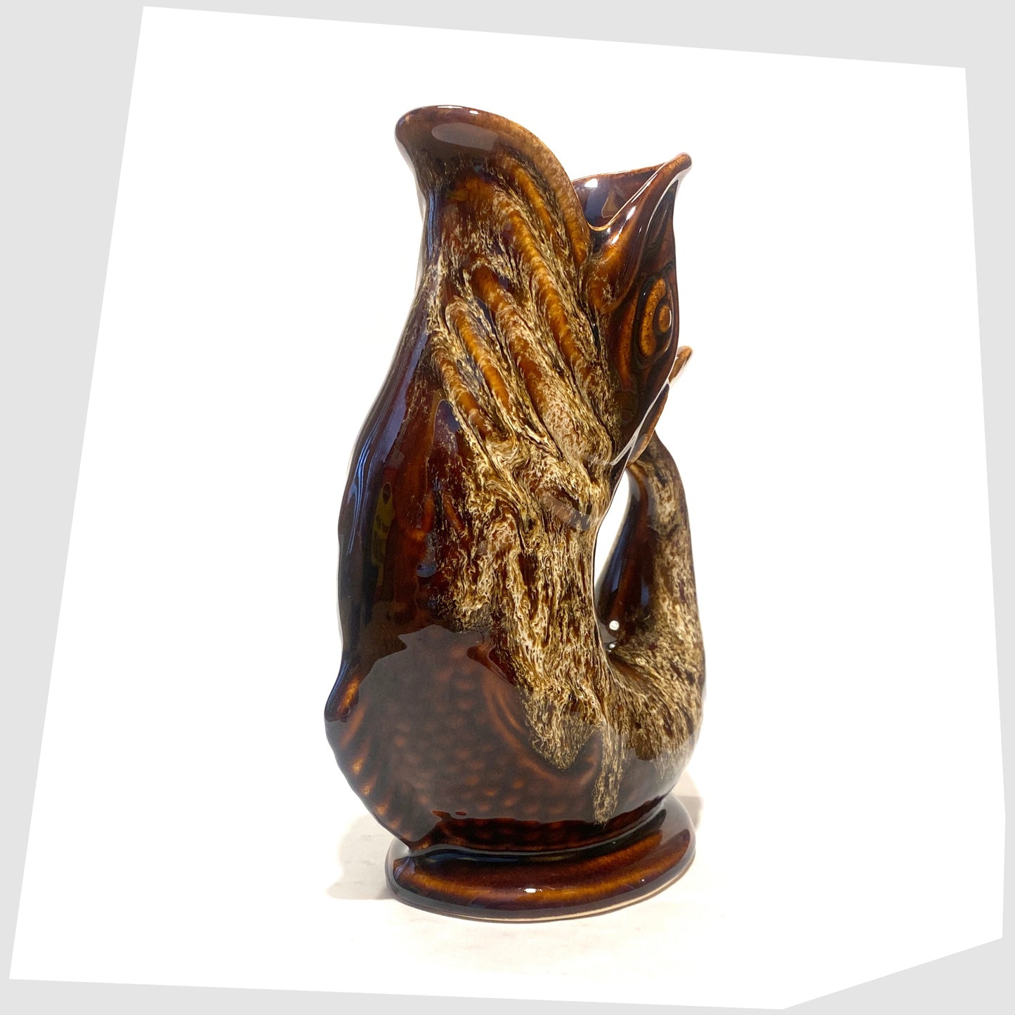 Front of the Fosters Studio Pottery Glugglr Jug in a chestnut brown with amber drip glaze, shown on a white background