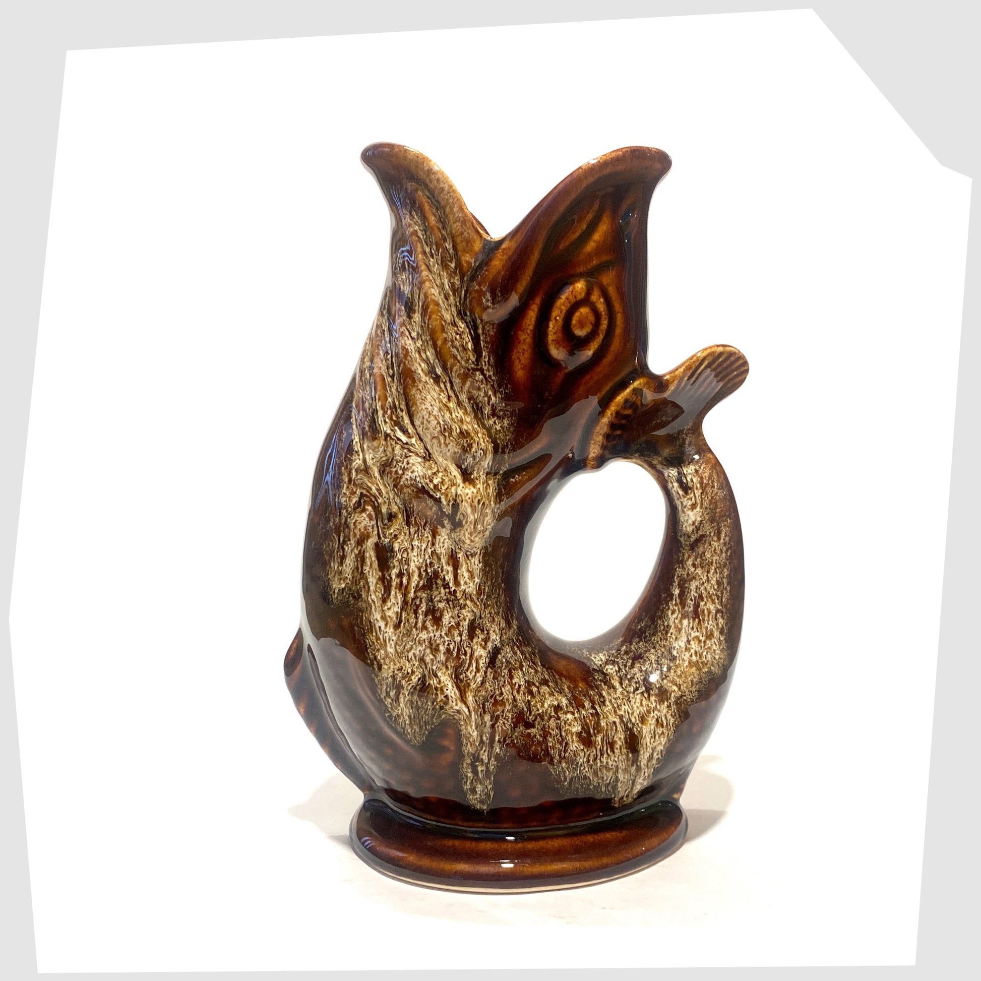 Vintage Fosters Studio Pottery Glugglr Jug in a chestnut brown with amber honeycomb drip glaze, shown on a white background