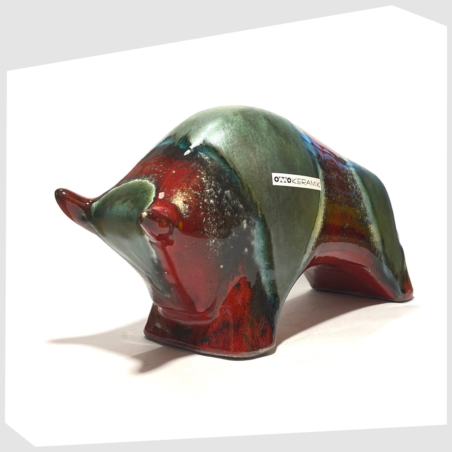 large ceramic bull sculpture by otto keramik in bolivia glaze of red and sea green bands