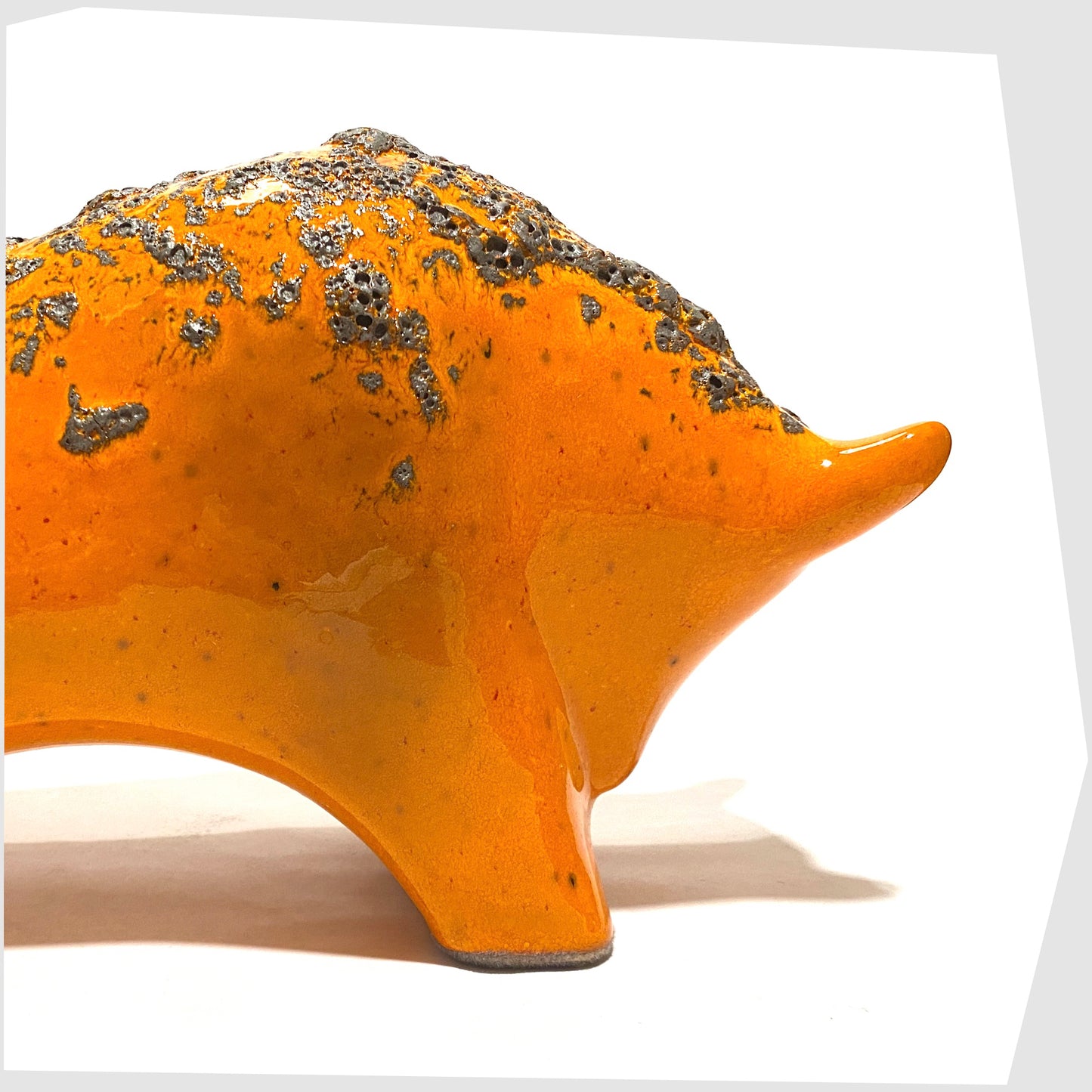 close up of the large otto keramik bull in vivid orange with fat lava stripe on the rear