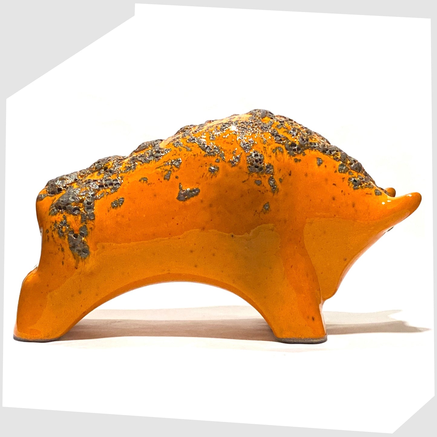 large otto keramik bull in vivid orange with fat lava stripe along the spine