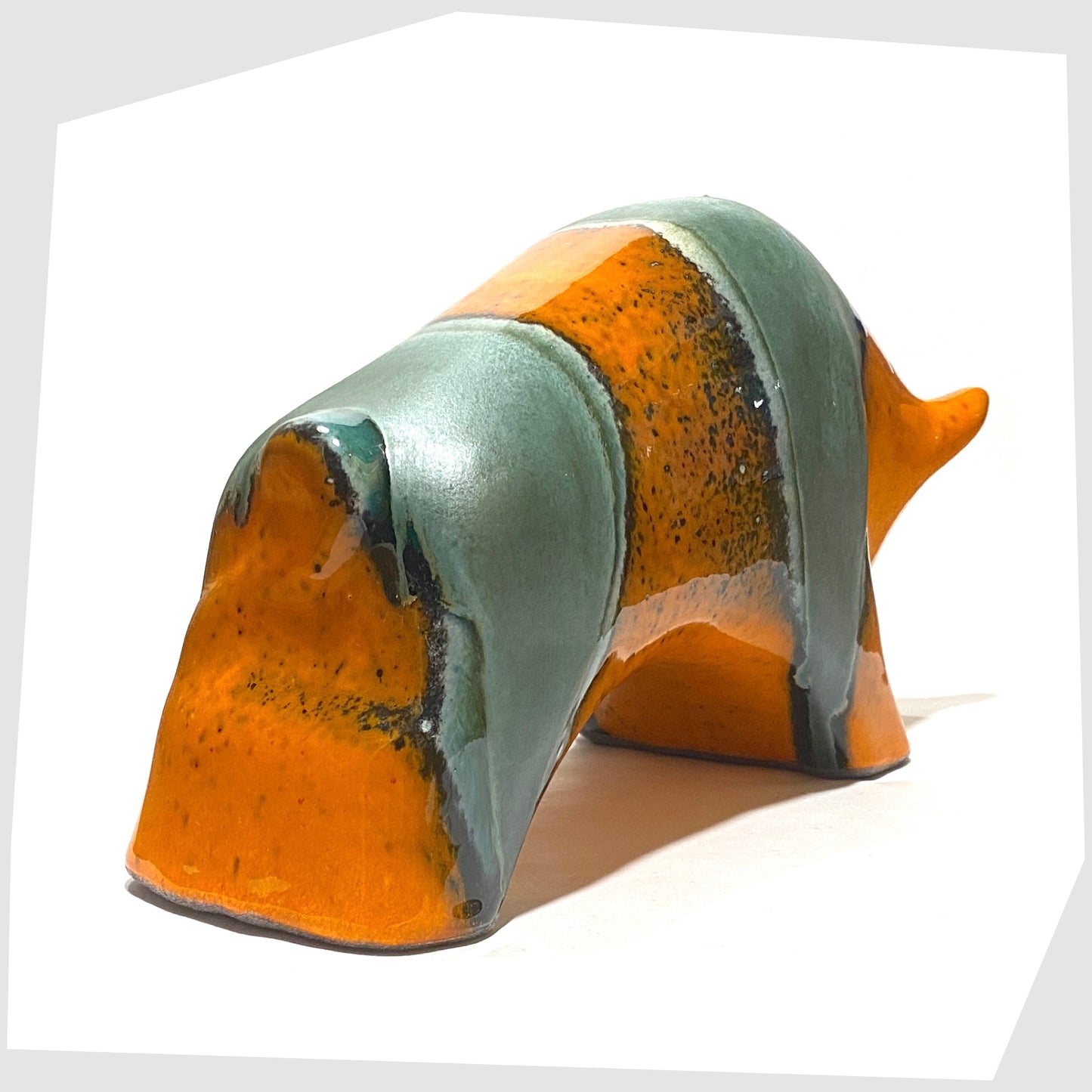 rear of the otto keramik large bull in orange and sea green drip glazing