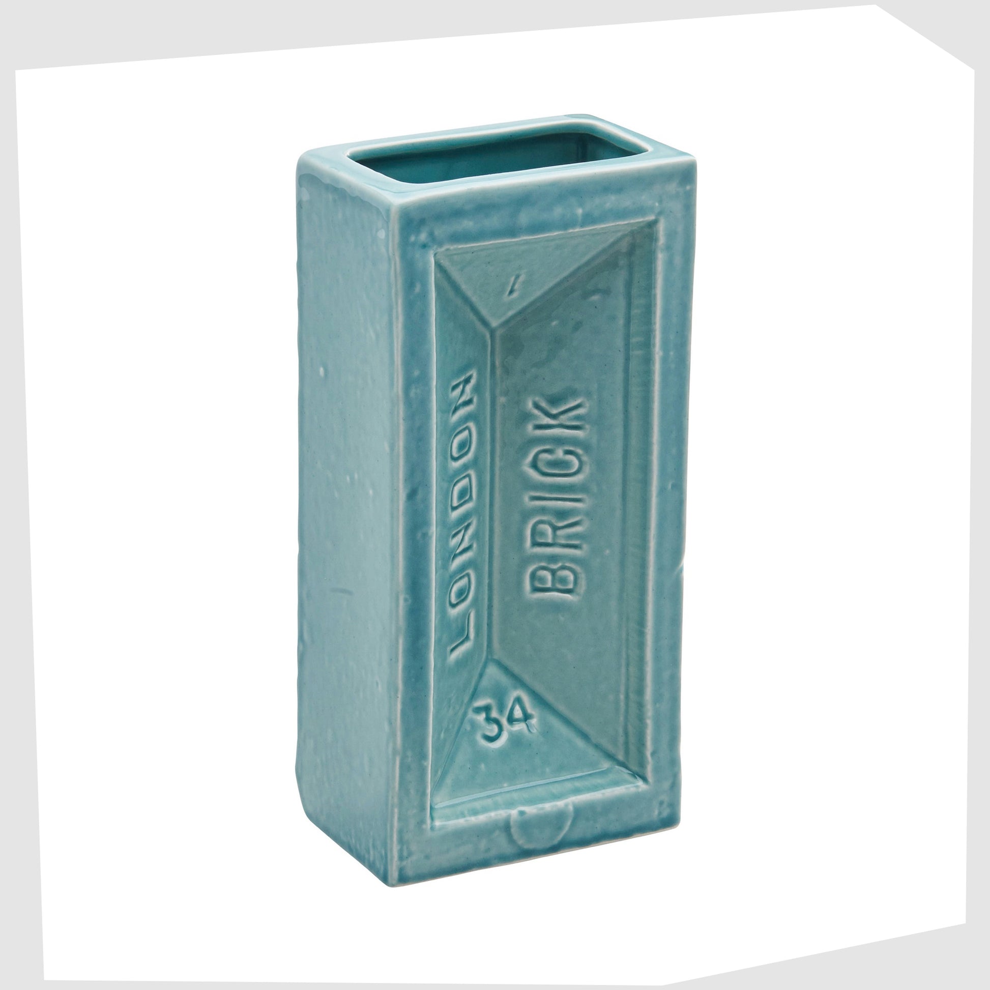 turquoise-blue-ceramic-vase-in-the-shape-of-an-iconic-london-brick