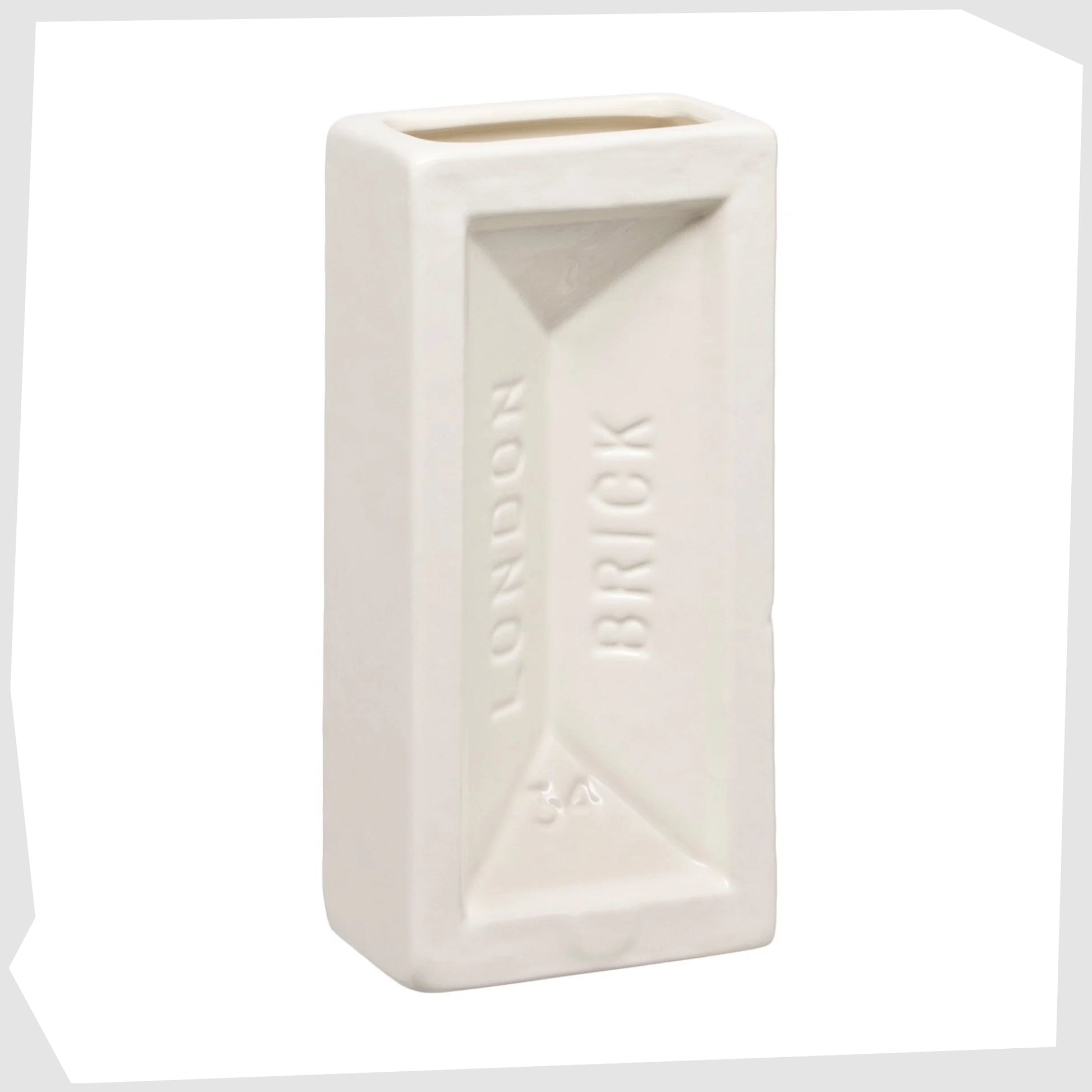 Stolen Form London Brick Vase in white glaze. Cast from an iconic london building brick and reimagined in glazed earthenware ceramic. 