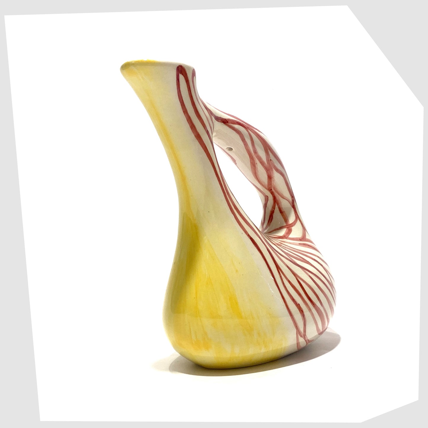 spout of the Lux Marmaca Italian Pottery Pitcher in a yellow and white glaze with hand drawn red lines