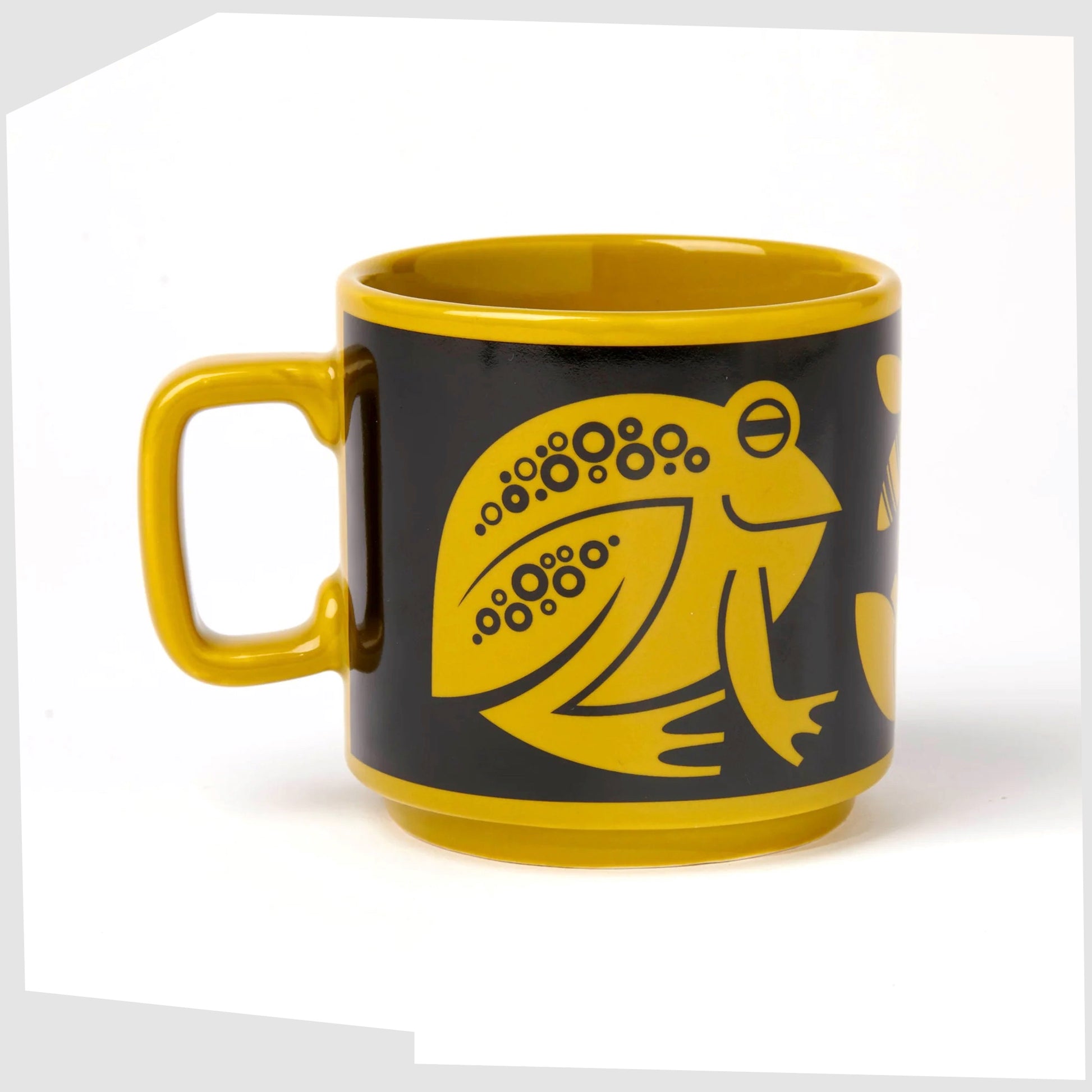 magpie x hornsea frog mug. Charteuse yellow mug featuring an illustration of two frogs