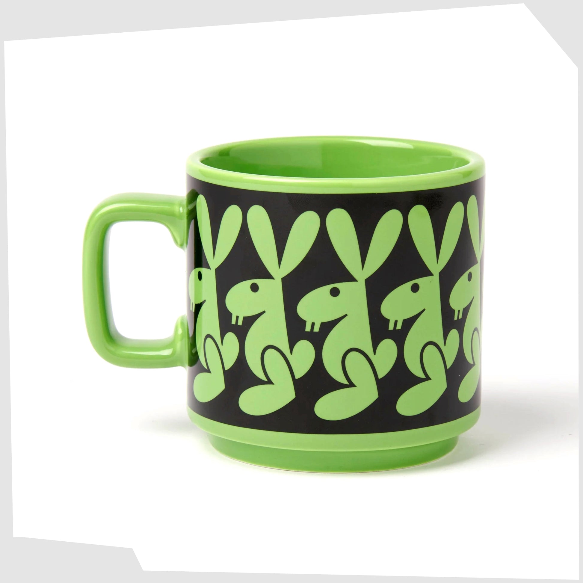magpie x hornsea pottery rabbit mug. Green stoneware mug with black repeating pattern of a bunny rabbit.