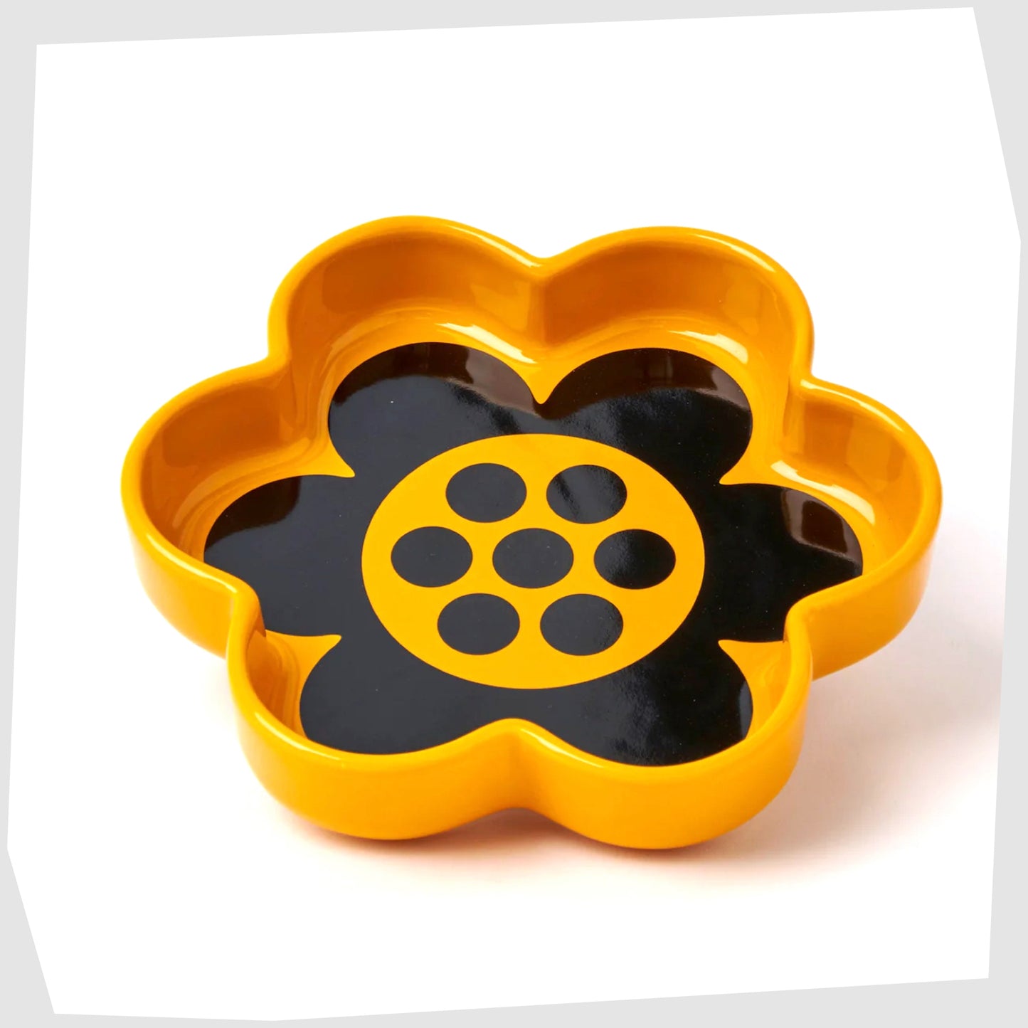 Magpie X Hornsea Flower Trinket Tray, flower shaped trinket tray in yellow glaze with stylised black geo flower design