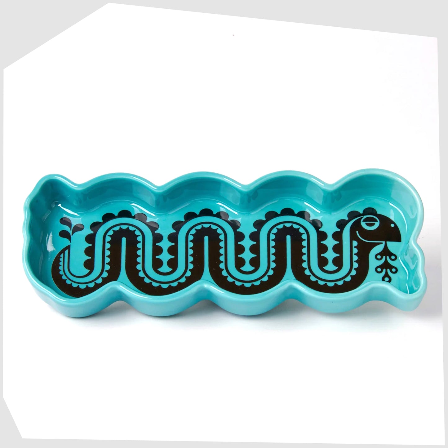 magpie x hornsea nessie trinket tray, b lue stoneware ceramic dish with a black print of a swirling sea monster