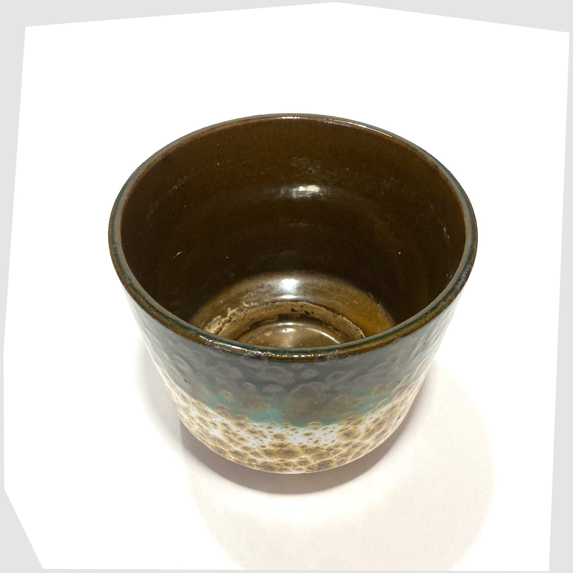 top rim of the Marei Keramik Planter in fat lava glaze with bands of green and navy glaze