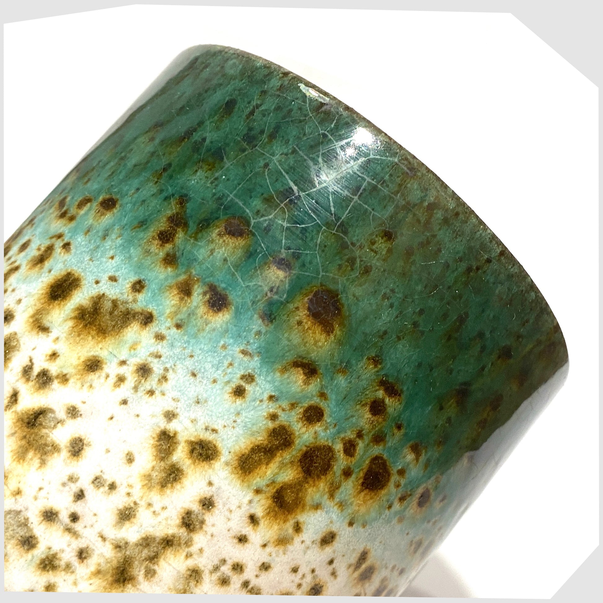 close up of the Marei Keramik Planter in green and white speckled glaze