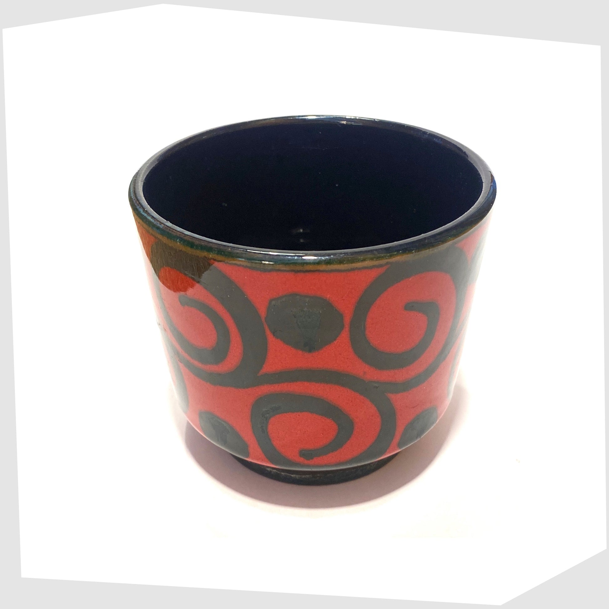 top rim of the west german pottery planter made by marei keramik, in a vivid red glaze with black swirling lines