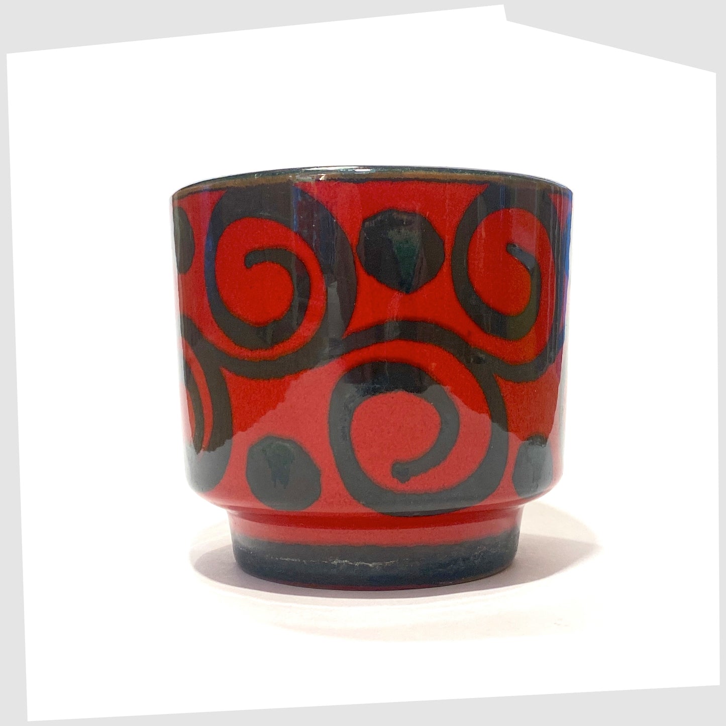 west german pottery planter made by marei keramik, in a vivid red glaze with black swirling lines
