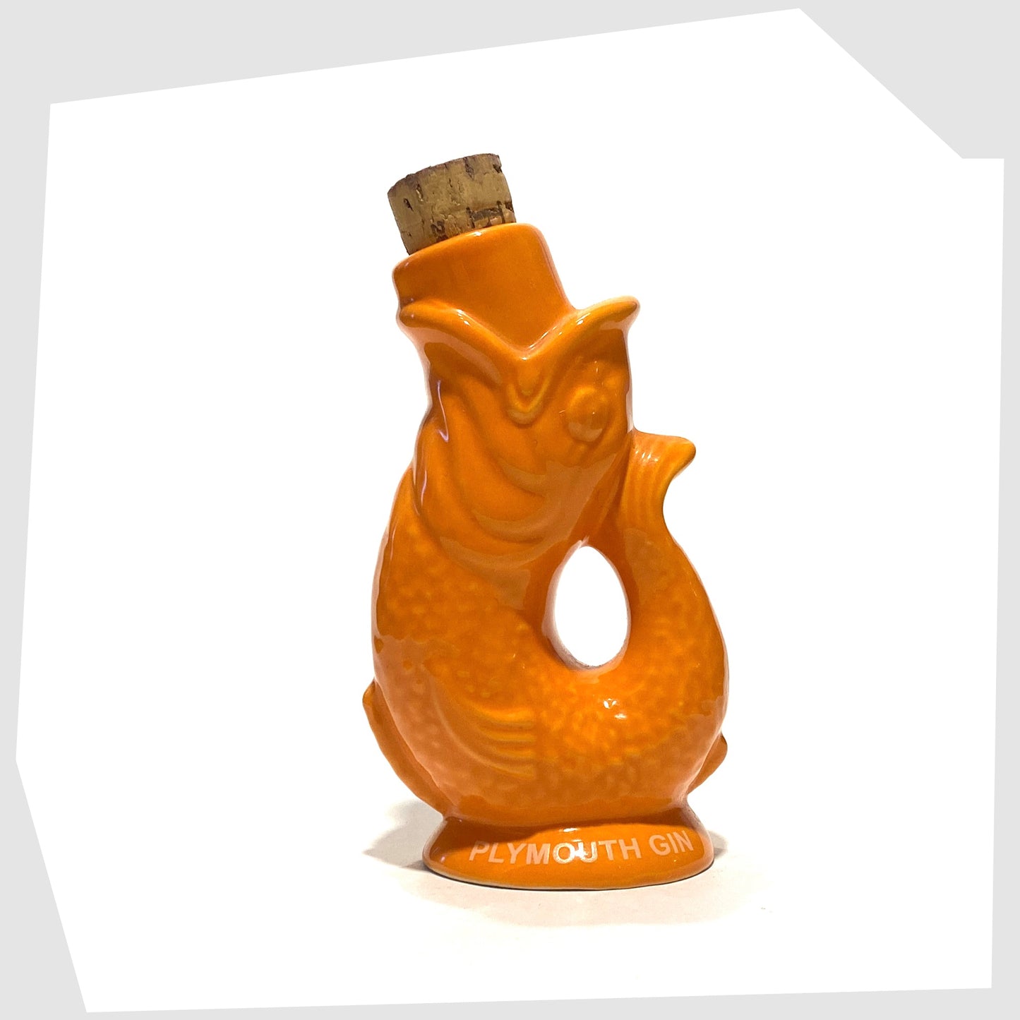 plymouth gin mini gluggle jug in vibrant orange glaze with white text around the base