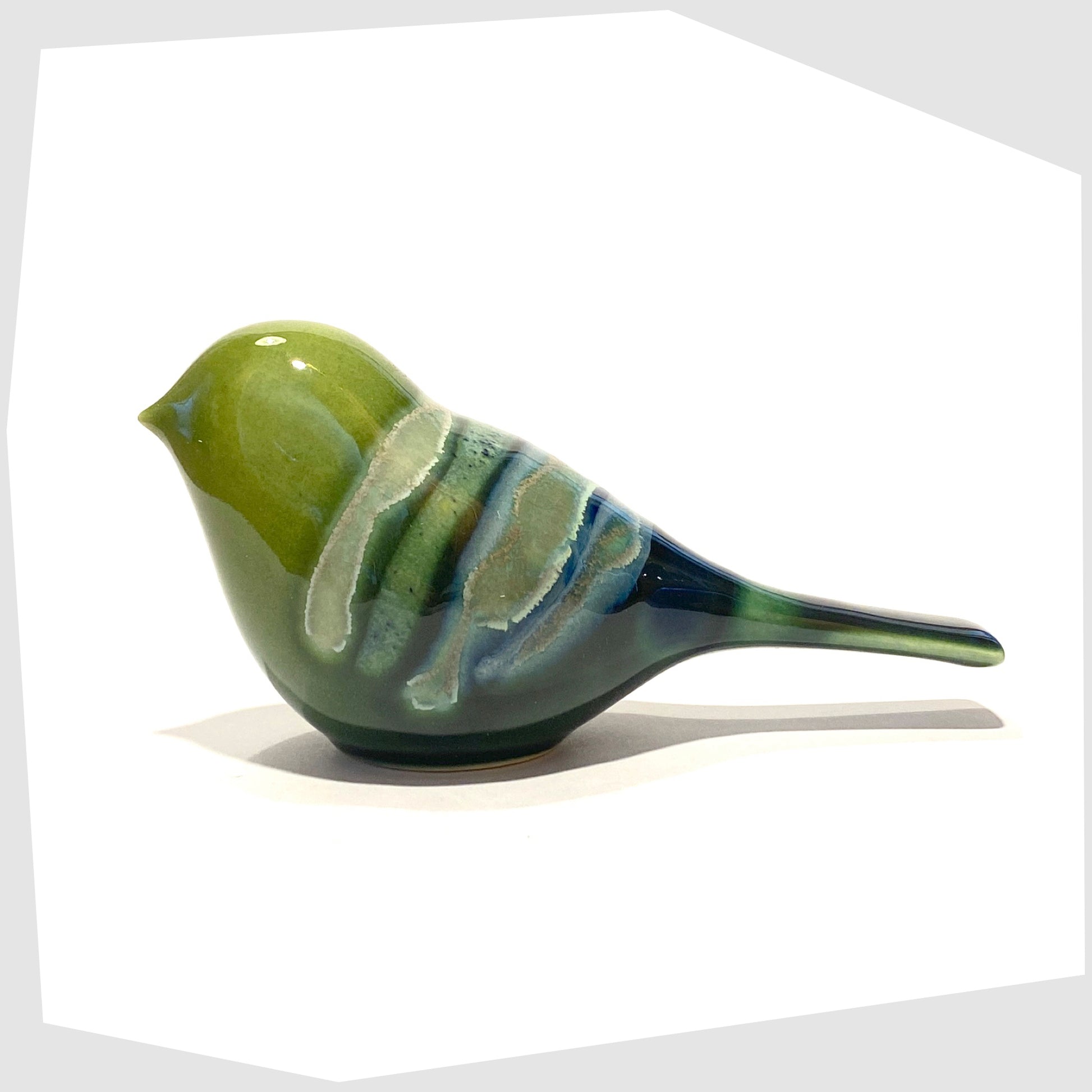 poole pottery perching bird ornament finished in the maya glaze of green, blue and warm grey
