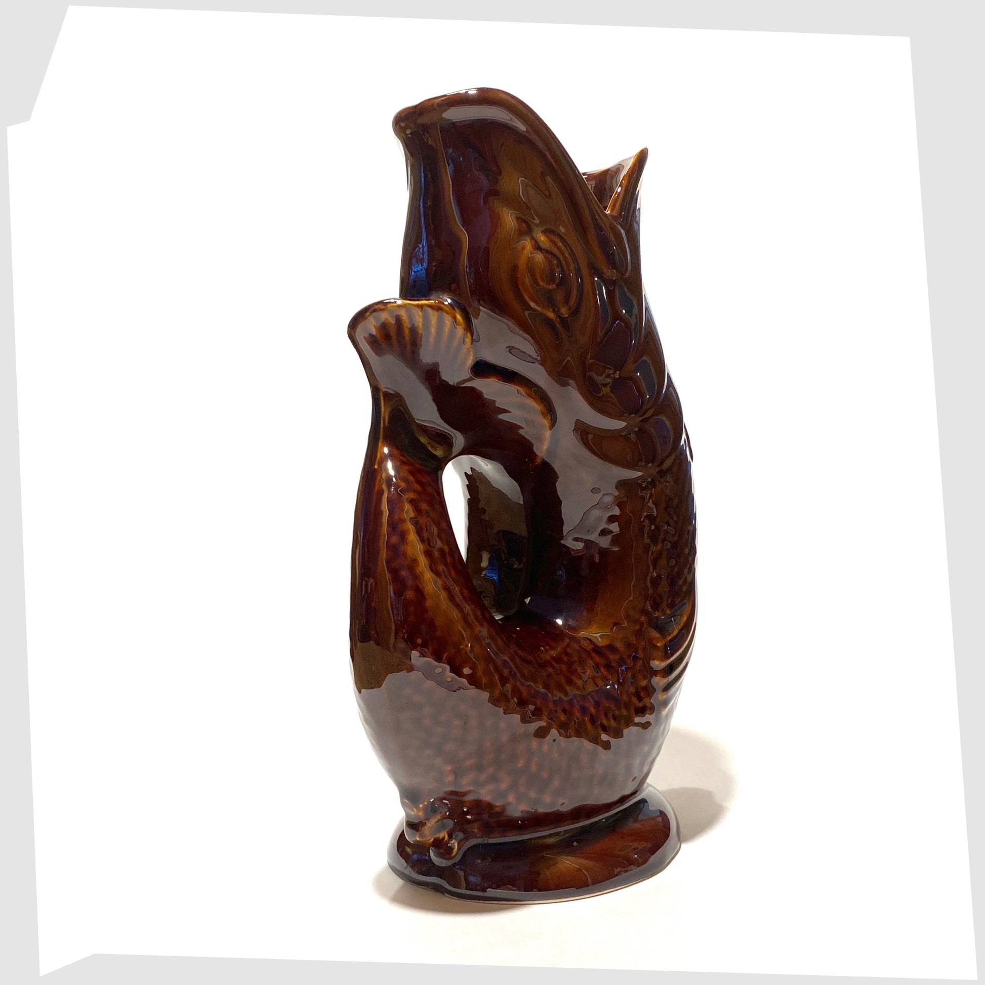 tail of the vintage Dartmouth Pottery Gluggle Jug in chestnut brown glaze