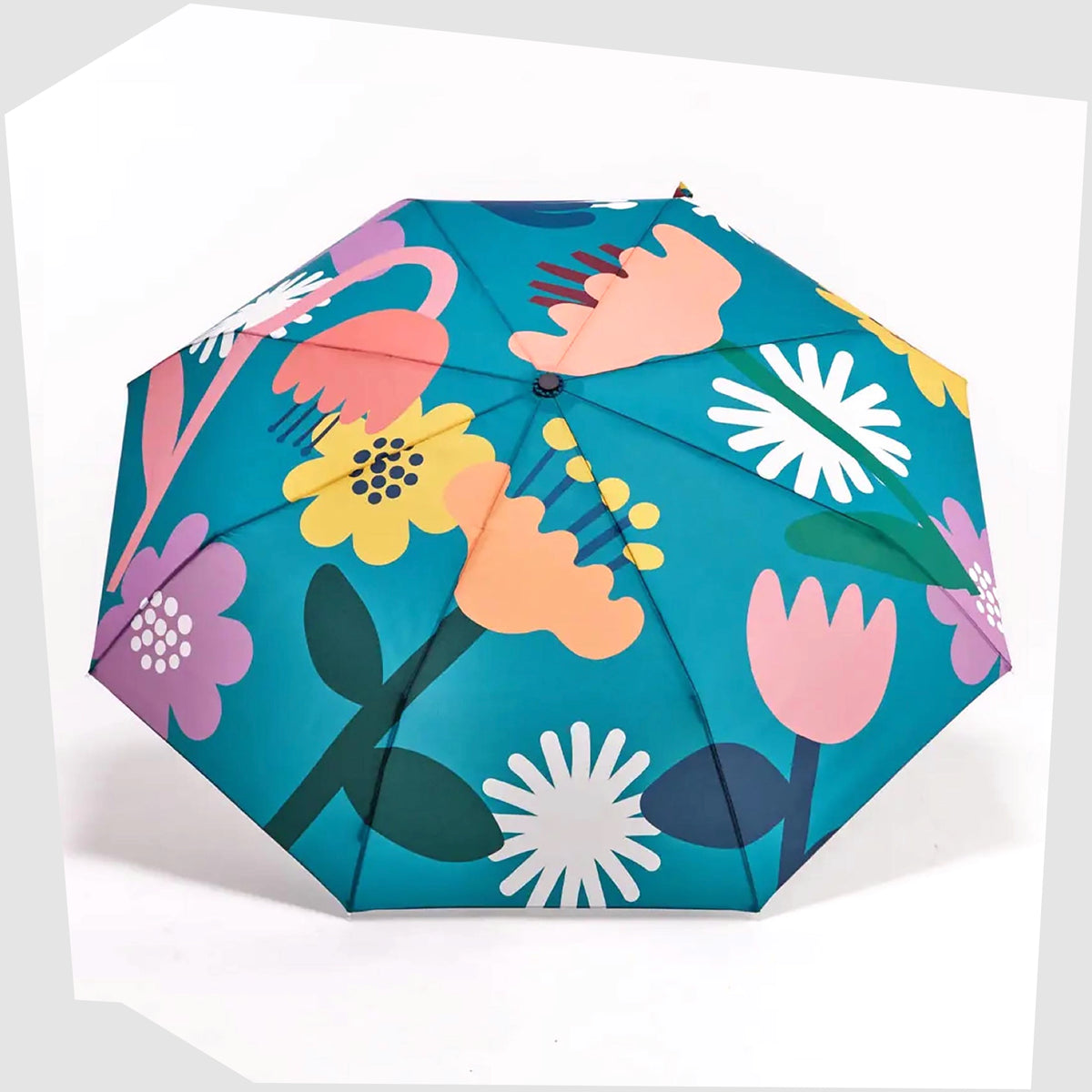 Original Duckhead Umbrella in Bloom print of multicoloured stylised flowers on a teal fabric, shown open on a white background