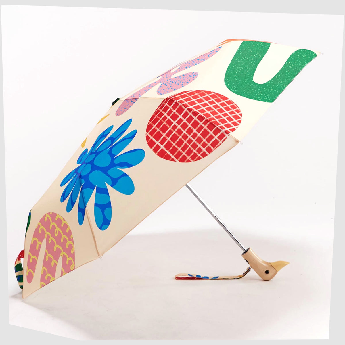 Original Duckhead Umbrella in Deli pattern of multicoloured abstract forms on a beige fabric, shown open on a white background