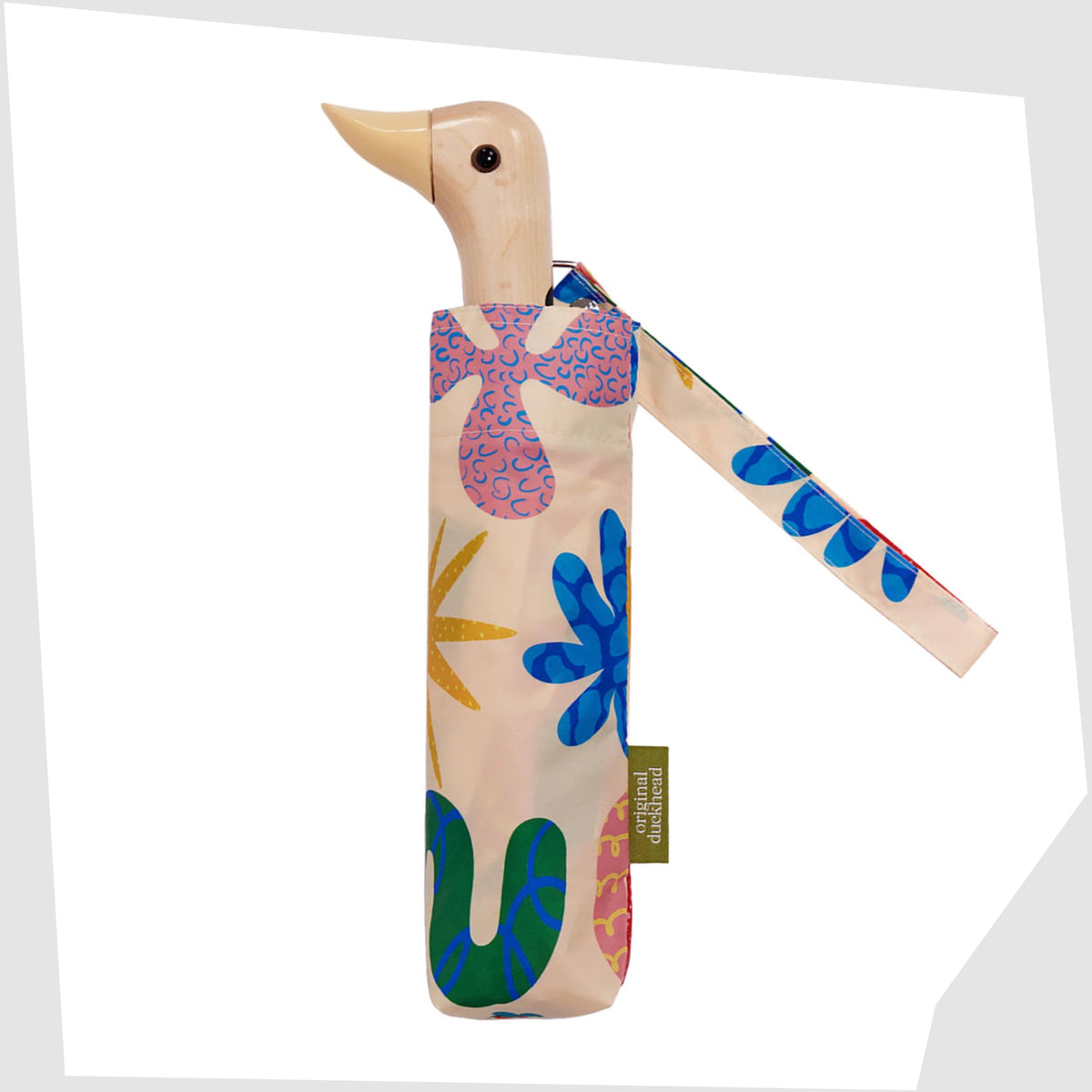 Original Duckhead Umbrella in Deli pattern of multicoloured abstract forms on a beige fabric, shown closed on a white background