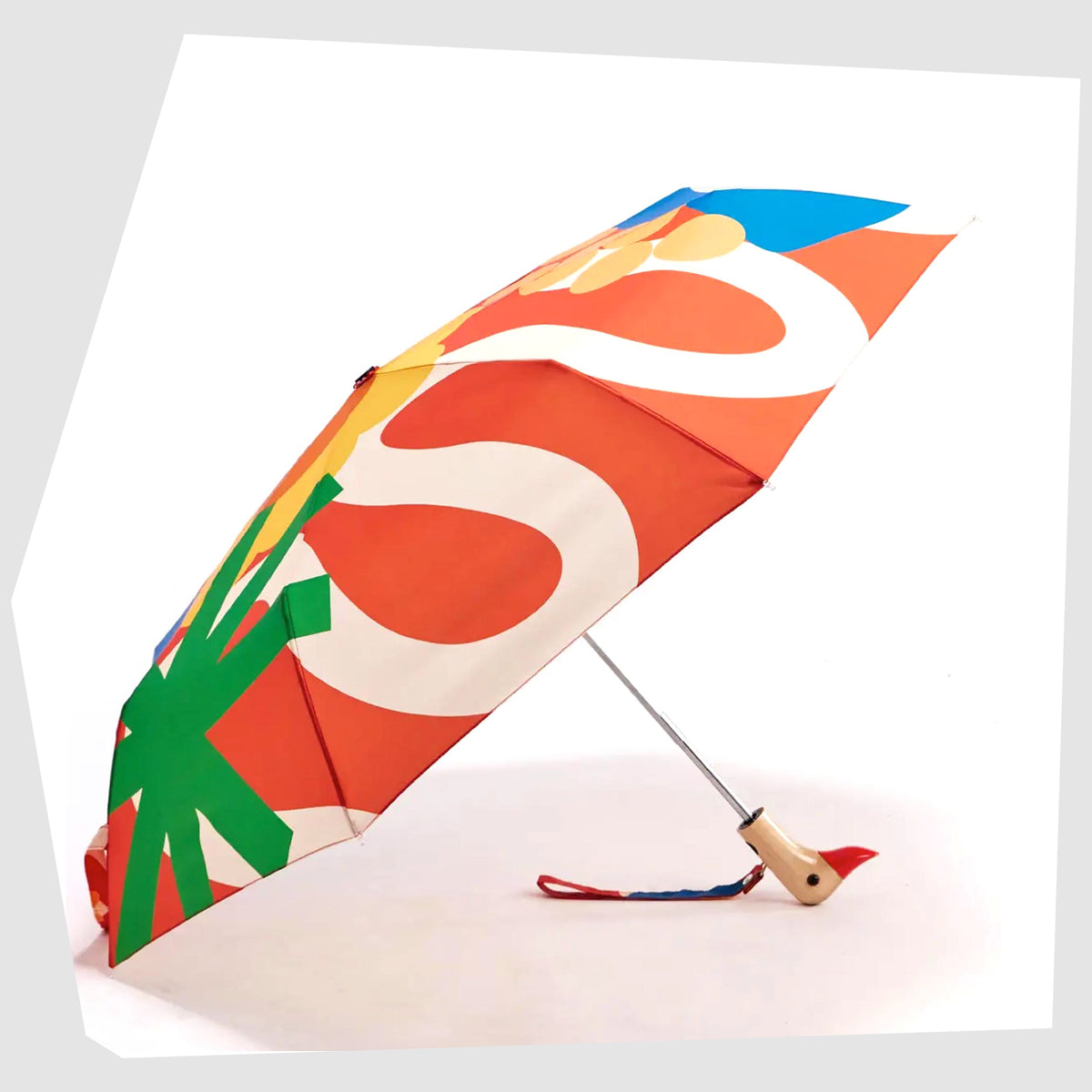 Salsa Original Duckhead Umbrella in a red fabric with abstract and floral multicoloured shapes, shown open on a white background