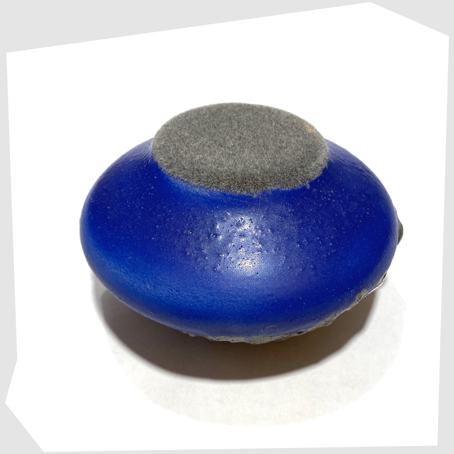 Felted base of the Otto Keramik 203 Vase in blue glaze with grey fat lava glazing, shown on a white background