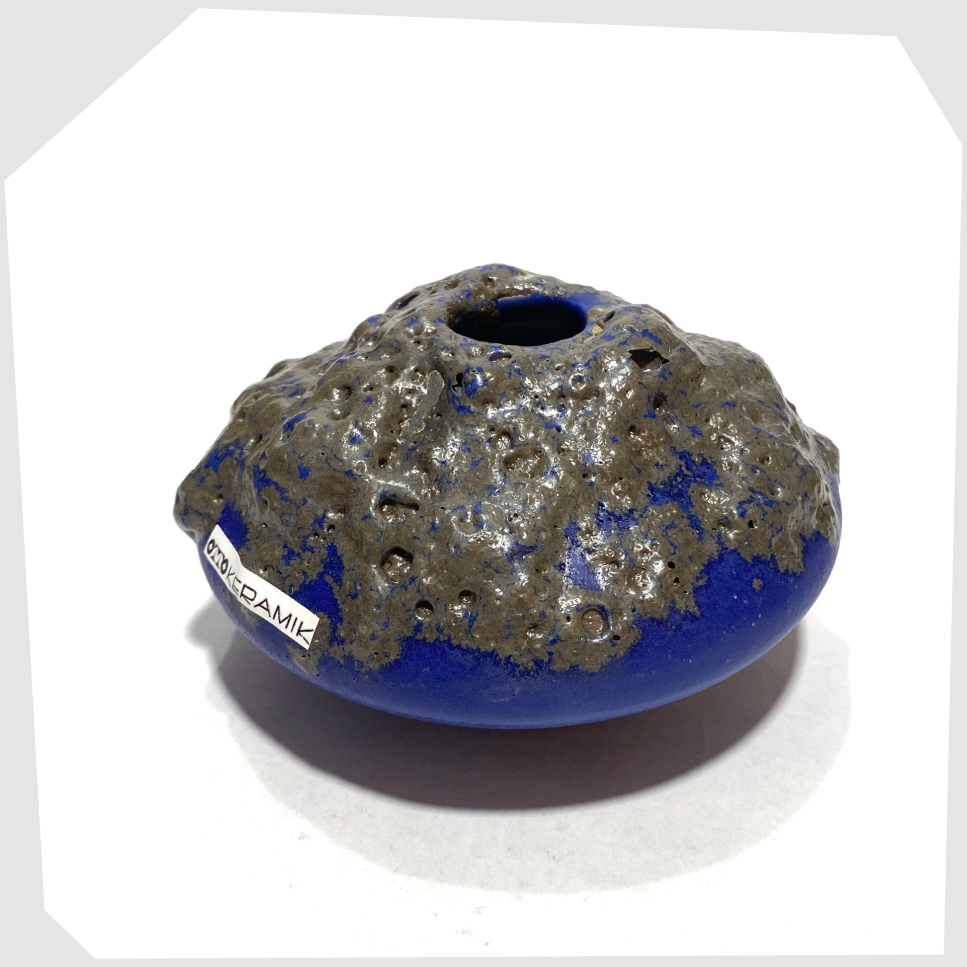 Top rim of the Otto Keramik 203 Vase in blue glaze with grey fat lava glazing, shown on a white background