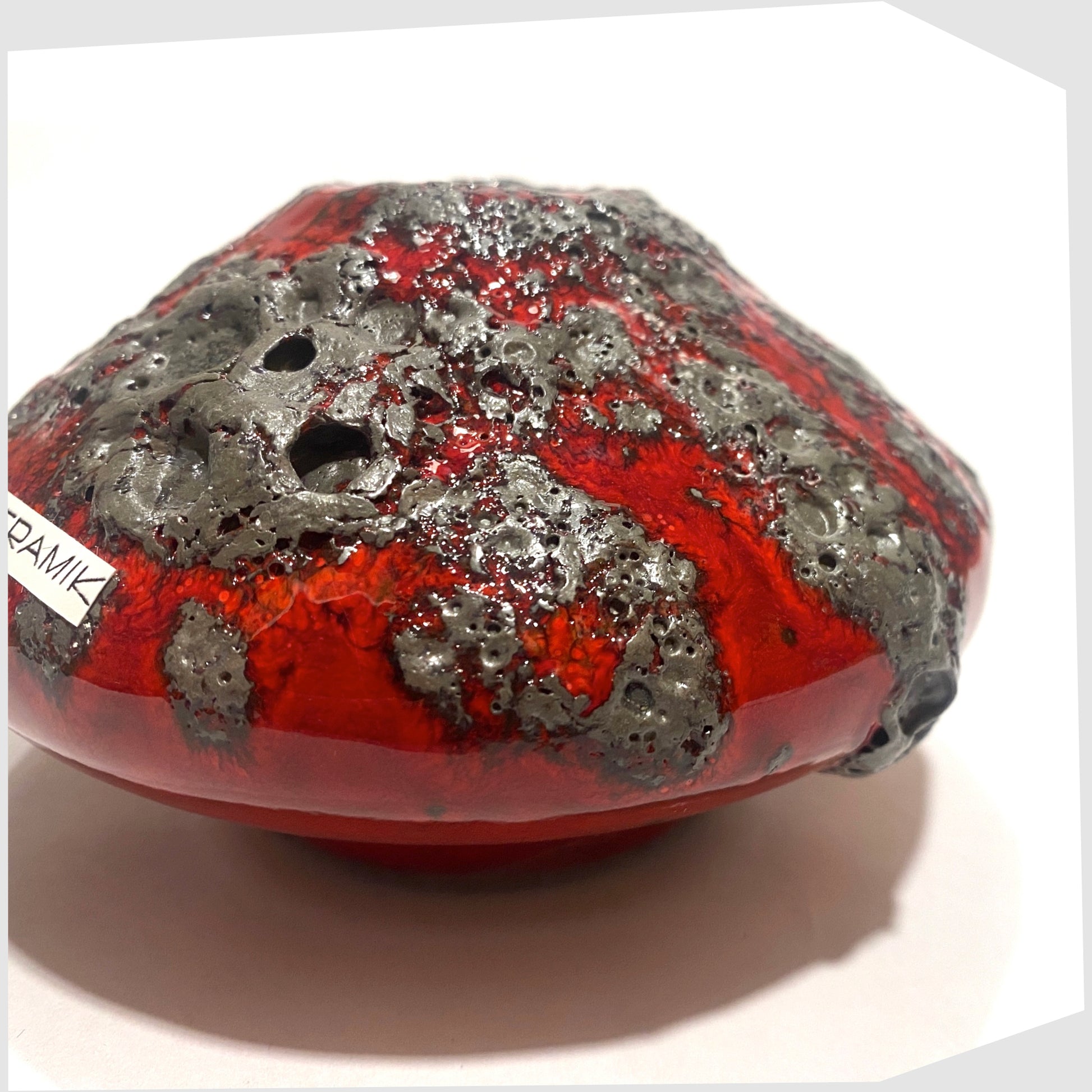 Close up of the Otto Keramik 203S Vase in rich red with textured fat lava glaze