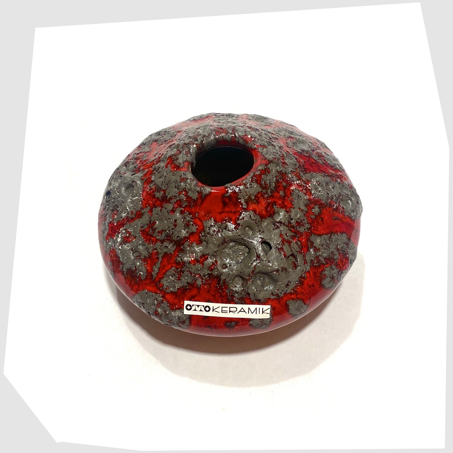 Top rim of the Otto Keramik 203S Vase in rich red with textured fat lava glaze
