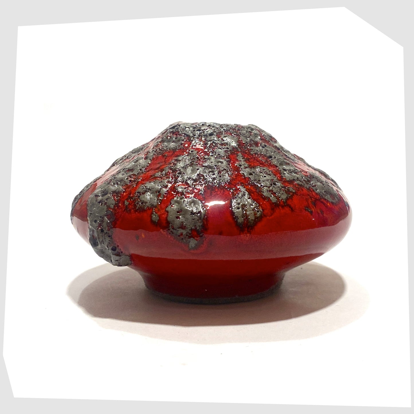 Side of the Otto Keramik 203S Vase in rich red with textured fat lava glaze