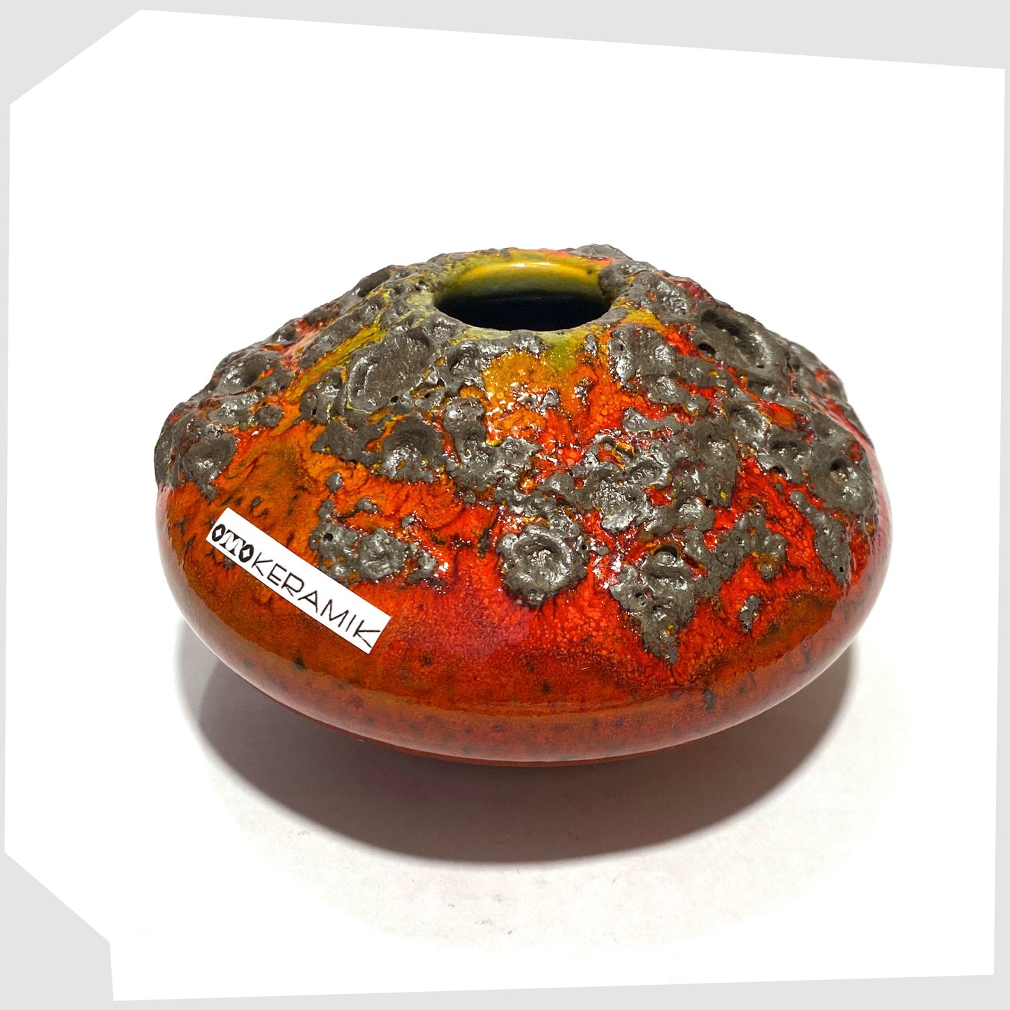 Small Otto Keramik 203 Vase in red glaze with yellow around the top rim, shown on a white background
