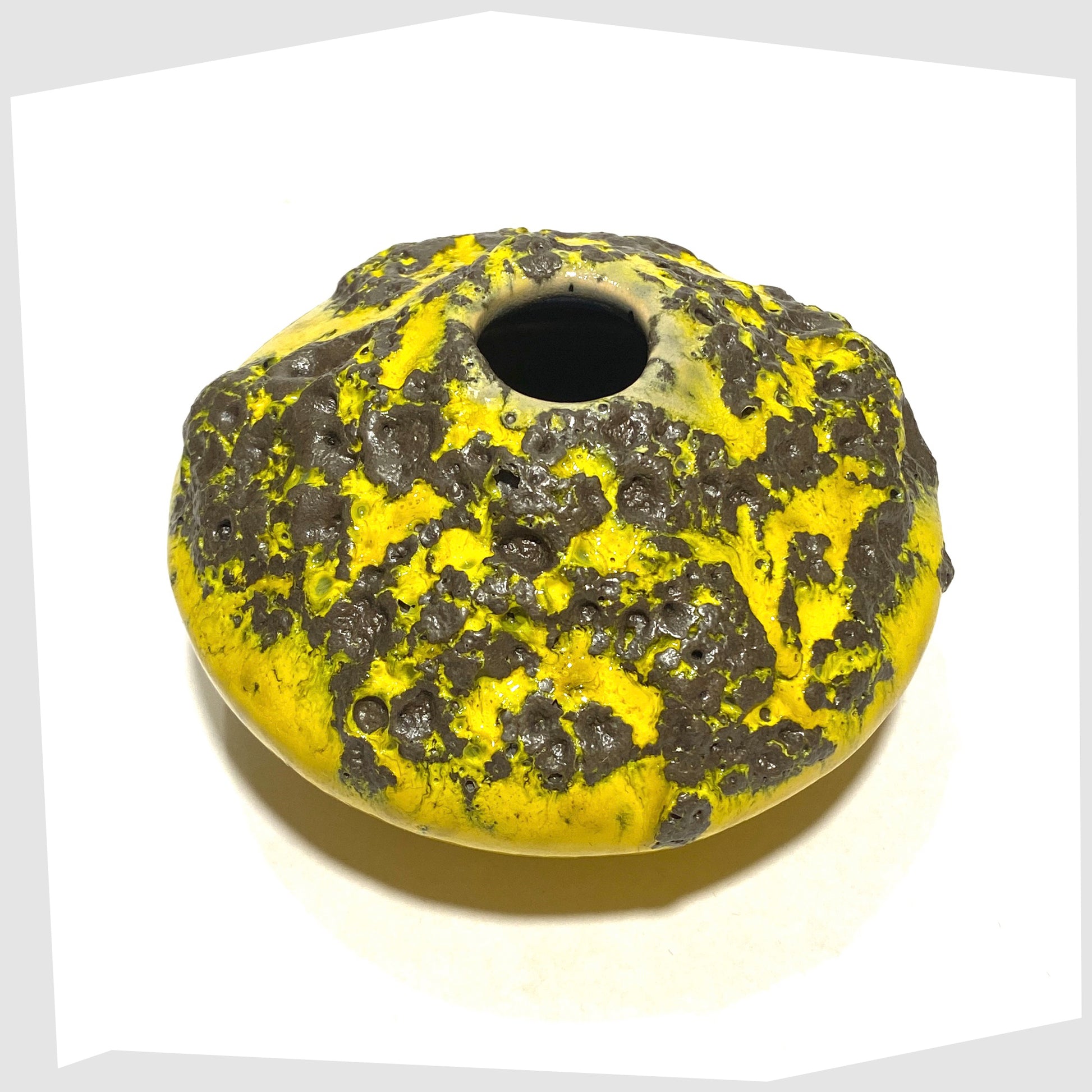 top rim of the Otto Keramik 203 Vase in yellow with grey fat lava glaze, shown with the otto keramik sticker on a white background