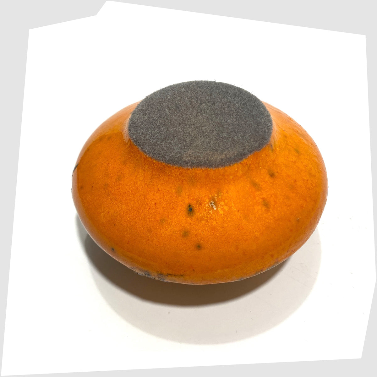 Felted base of the Otto Keramik Vase, model 203s, in orange glaze with grey fat lava, shown on a white background