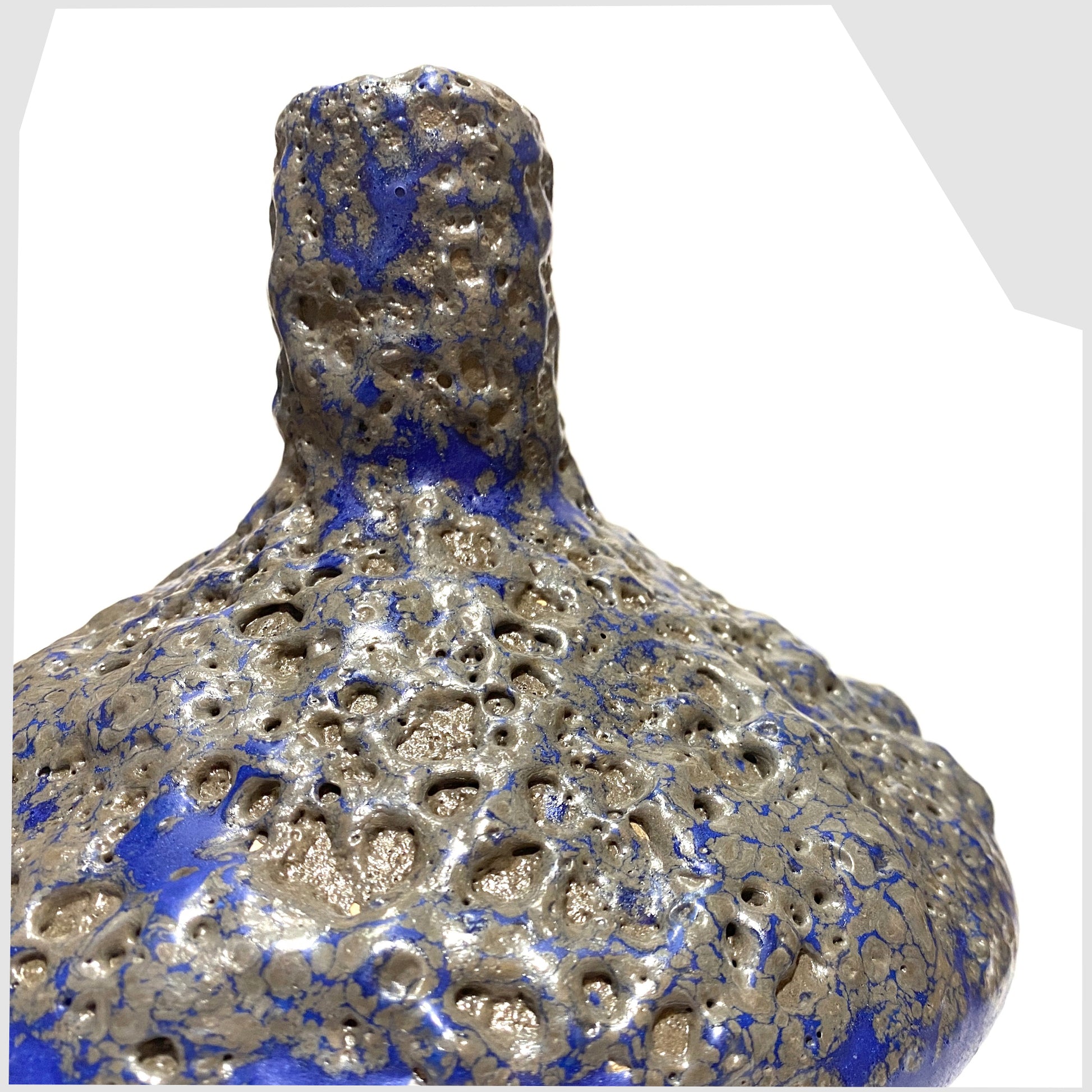 Close up of the Otto Keramik 206 Vase in a vivid blue colour with grey fat lava glaze, shown on a white background