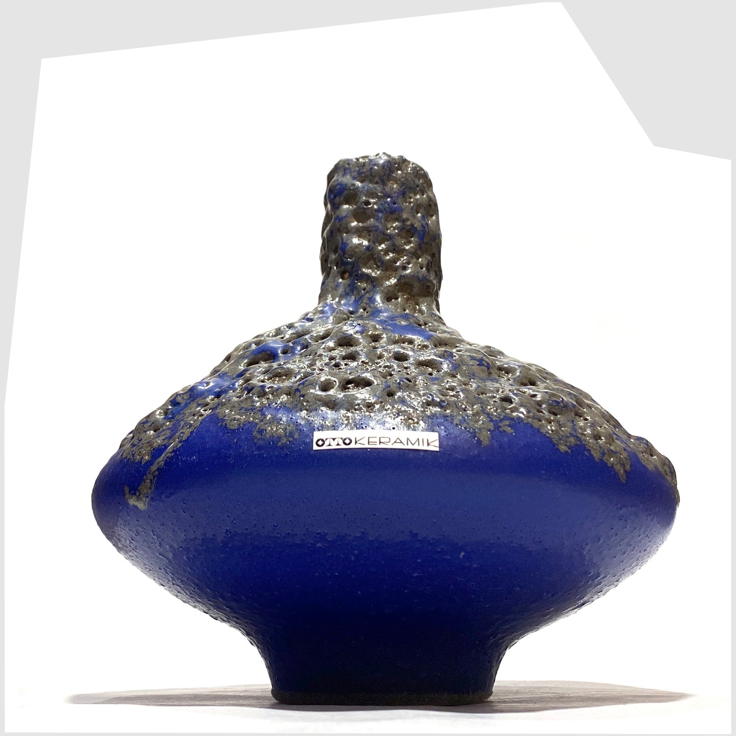 Mushroom shaped Otto Keramik 206 Vase in a vivid blue colour with grey fat lava glaze, shown on a white background
