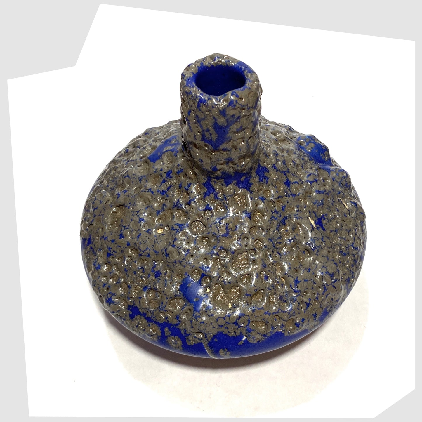 Overhead view of the Otto Keramik 206 Vase in a vivid blue colour with grey fat lava glaze, shown on a white background