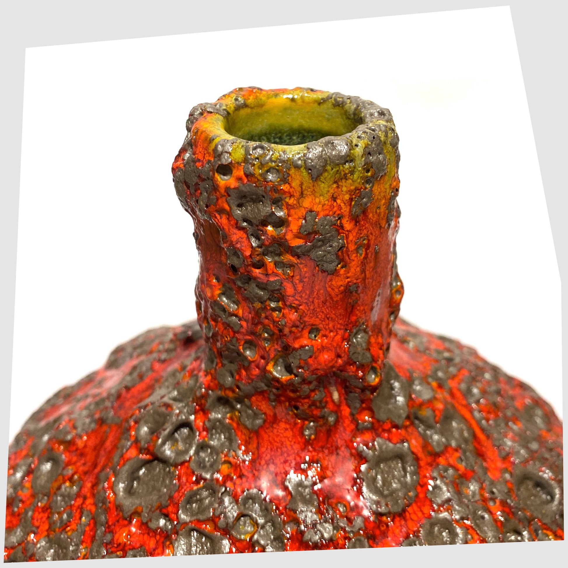 Top rim of the Otto Keramik 206 Vase in a rich red glaze with yellow hues around the rim and deep fat lava glazing, shown on a white background