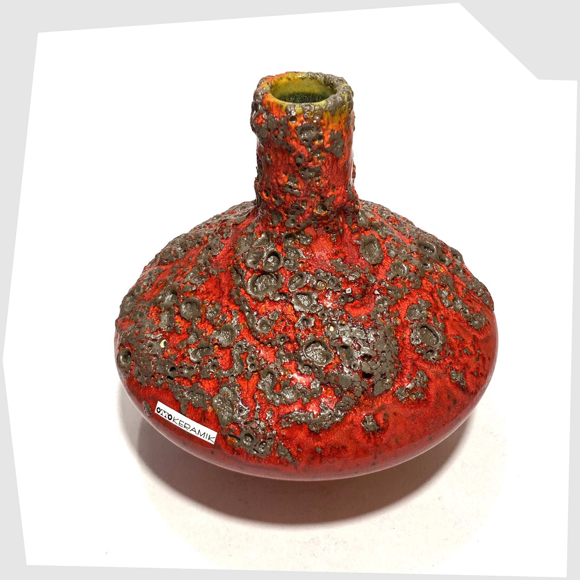 West German Pottery-inspired Otto Keramik 206 Vase in a rich red glaze with yellow hues around the rim and deep fat lava glazing, shown on a white background