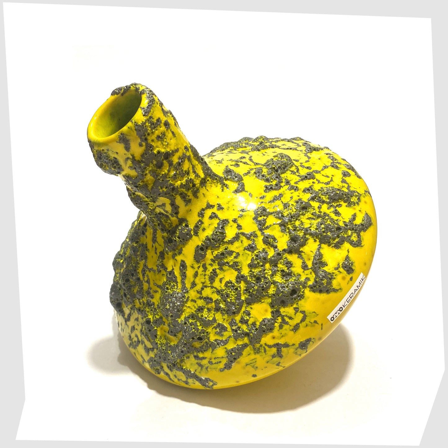 Angled view of the Otto Keramik 206 Vase in vibrant yellow glaze with deep fat lava, shown on a white background