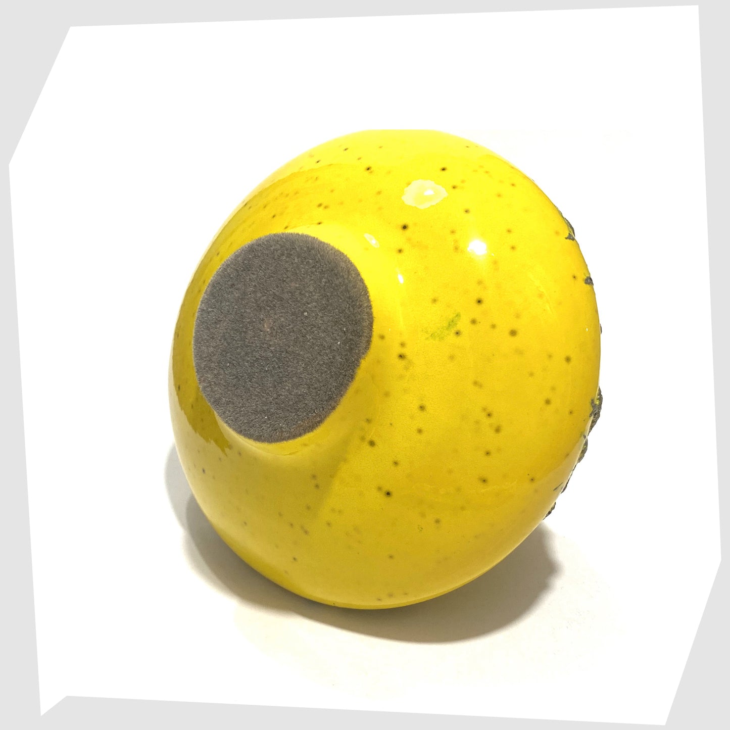 Felted base of the Otto Keramik 206 Vase in vibrant yellow glaze with deep fat lava, shown on a white background