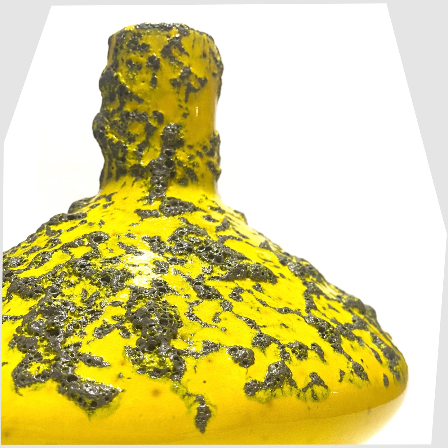 Close up of the Otto Keramik 206 Vase in vibrant yellow glaze with deep fat lava, shown on a white background